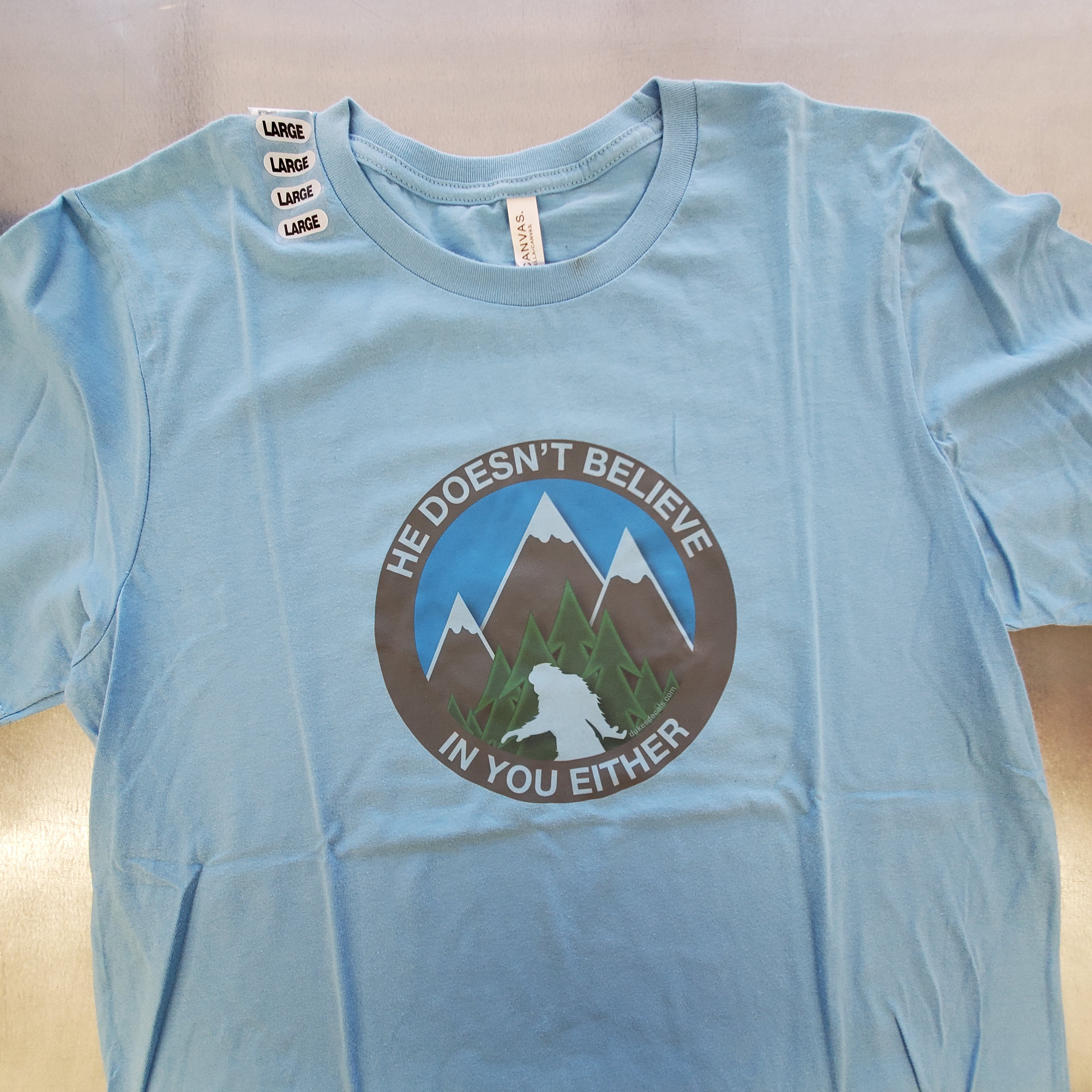 He Doesn't Believe In You Either Bigfoot T-shirts