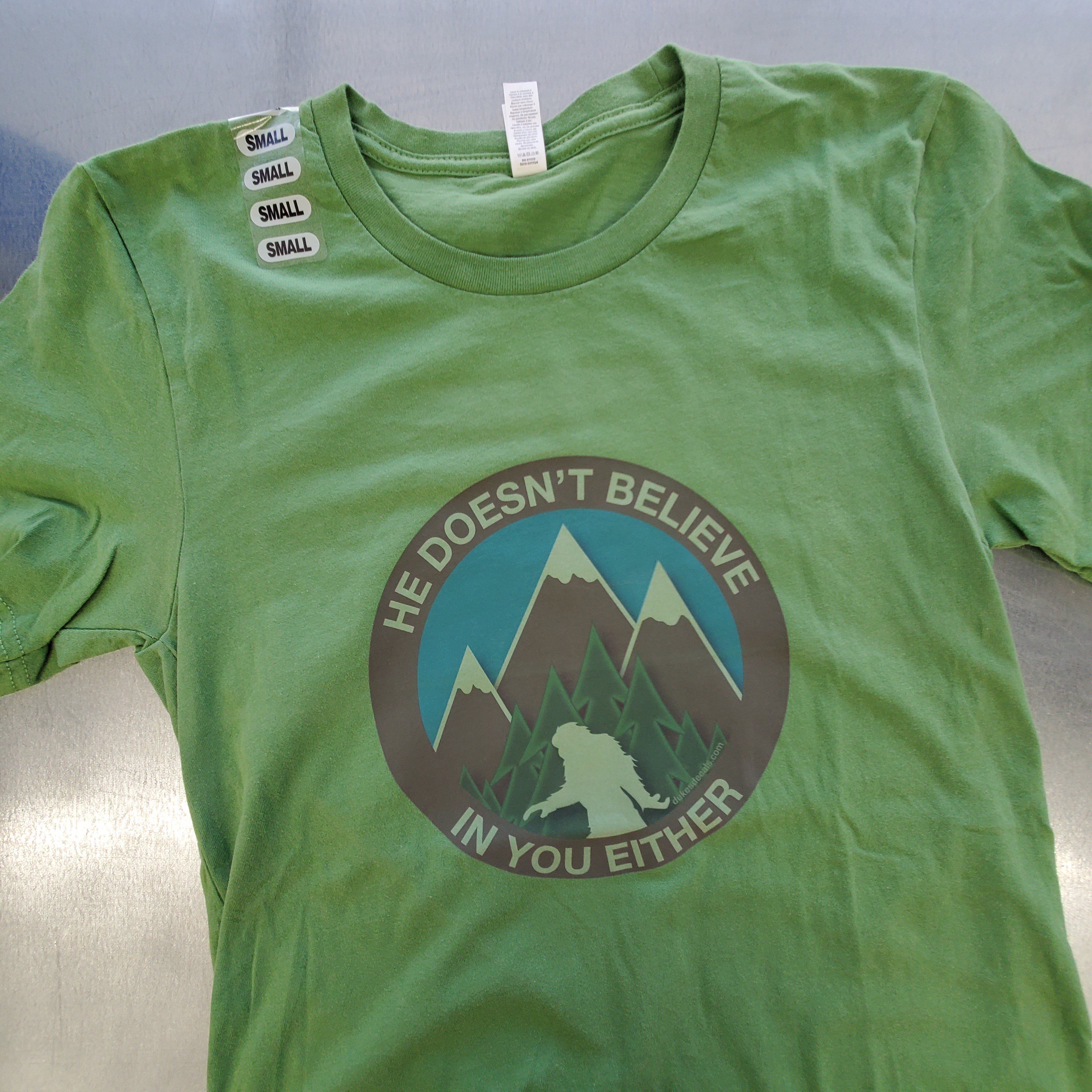 He Doesn't Believe In You Either Bigfoot T-shirts